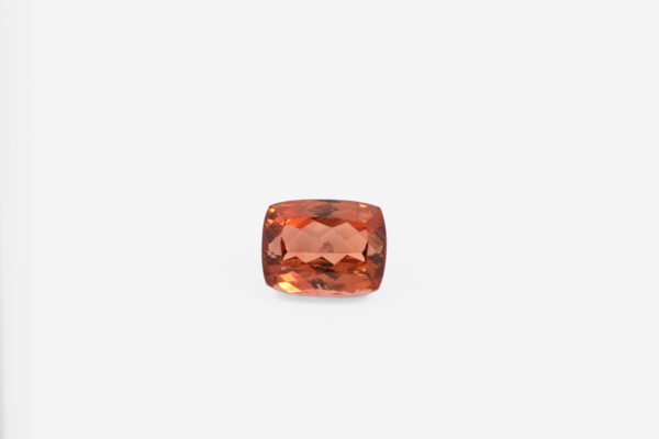 10.99 carat cushion-cut orange tourmaline, brownish-orange cognac color, VS clarity from Mozambique.