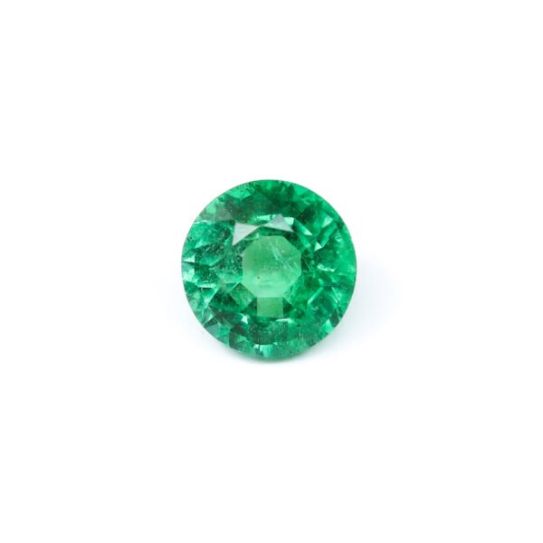 "0.82 carat natural Zambian emerald, vibrant green color, round brilliant cut, minor oil treatment."